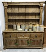 A 19th Century pine dresser with three tier plate rack above a base of three drawers above three