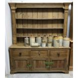 A 19th Century pine dresser with three tier plate rack above a base of three drawers above three