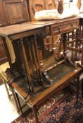 An Edwardian mahogany two drawer writing table on square tapered legs to castors,