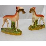 A pair of Victorian Staffordshire figures of "Greyhounds with hare quarry"