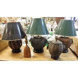 Four various modern canework based table lamps and a turned wooden table lamp CONDITION