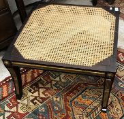 A 19th Century rosewood cane seated stool in the manner of Thomas Hope raised on square tapered and