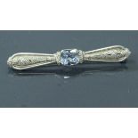 A silver and aquamarine Art Deco style brooch of ribbon form