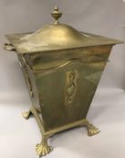 A William Tonk & Son lidded brass coal bucket of square taperring form,