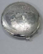 An Indian silver powder compact, the top engraved with map of India and Ceylon,