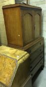 An early 20th Century mahogany bedroom cabinet with two cupboard doors enclosing shelf and two