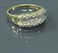 A yellow metal diamond set ring 3.