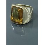 An 18 carat gold imperial topaz and diamond set ring 24 g CONDITION REPORTS