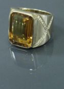 An 18 carat gold imperial topaz and diamond set ring 24 g CONDITION REPORTS