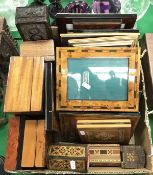 A box containing a collection of various wooden boxes and photograph frames