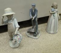 A collection of three various Lladro figures including "Switch Operator" limited edition 261/2000