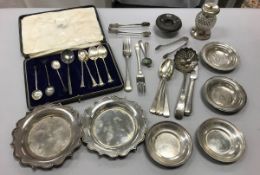 A collection of silver and Continental white metal to include a pair of pie crust coasters,