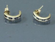 A pair of sapphire and diamond set hoop earrings