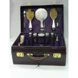 A Walker & Hall purple dyed leather ladies travelling vanity case with silver fittings,