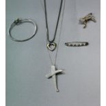 A collection of silver Tiffany jewellery comprising bangle, Paloma Picasso cross pendant,