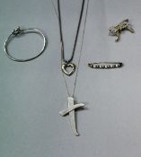 A collection of silver Tiffany jewellery comprising bangle, Paloma Picasso cross pendant,