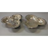A pair of silver trefoil dishes with embossed decoration (by Atkin Brothers, Sheffield 1899) 4.