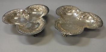 A pair of silver trefoil dishes with embossed decoration (by Atkin Brothers, Sheffield 1899) 4.