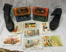 A box containing various model cars, a pair of vintage leather lace up ladies boots,