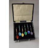 A set of six silver gilt and enamel decorated coffee spoons,
