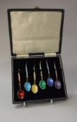 A set of six silver gilt and enamel decorated coffee spoons,