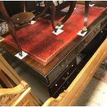 A modern reproduction mahogany kneehole desk