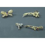 Four various gold and stone set brooches