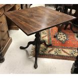 A late George III mahogany tea table,