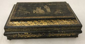 A 19th Century black lacquered and chinoiserie decorated jewellery casket of bombé sarcophagus form,