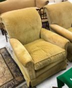 A pair of modern yellow cord upholstered armchairs in the Victorian manner raised on turned front