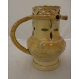A circa 1800 salt glazed puzzle jug decorated with various topers