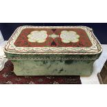 A 19th Century waisted ottoman with green velvet upholstery and needlework decorated top raised on