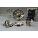 A box containing assorted plated wares to include chamberstick, photo frames, cups,