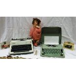 A Hermes Baby manual typewriter, an Olympia manual typewriter,