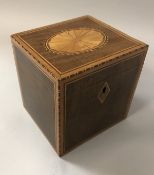 A 19th Century mahogany and marquetry inlaid single section tea caddy with fan inlaid medallion to