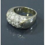 An 18 carat white gold ring set with seventeen diamonds 9 g