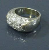 An 18 carat white gold ring set with seventeen diamonds 9 g