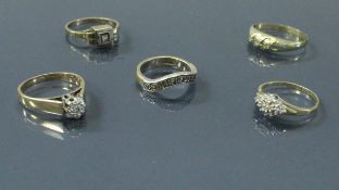 A collection of five 9 carat gold and diamond set rings 10 g