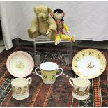 A collection of Tiffany and Co childrens mugs, Peggy Nesbitt costume and portrait dolls,