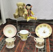 A collection of Tiffany and Co childrens mugs, Peggy Nesbitt costume and portrait dolls,