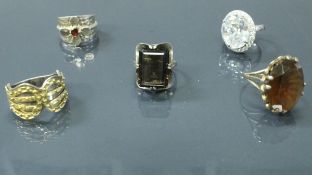 A collection of five various silver dress rings 1.