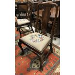 A set of eight early 20th Century Queen Anne style chairs with shaped bars and splat backs,