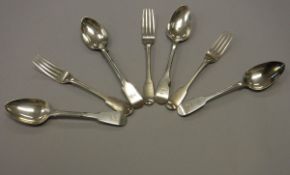 A set of five Georgian silver "Fiddle" pattern dessert forks and four spoons (by John Kerschner,