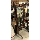 A 19th Century mahogany cheval mirror on turned and ringed supports to splayed square tapered legs,