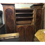 A Victorian mahogany breakfront triple wardrobe with linen press central section,