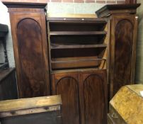 A Victorian mahogany breakfront triple wardrobe with linen press central section,