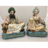 A pair of 19th Century Jacob Petit porcelain dressing table scent bottles as seated Turks,