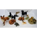 A collection of various porcelain and pottery figures including Beswick "Recumbent Fox" (1017) (x