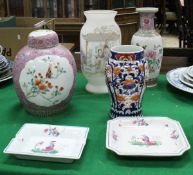 A Chinese famille-rose baluster shaped vase, similarly decorated ginger jar and cover,