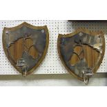 A pair of modern walnut and silver plated shield shaped candle sconces,
